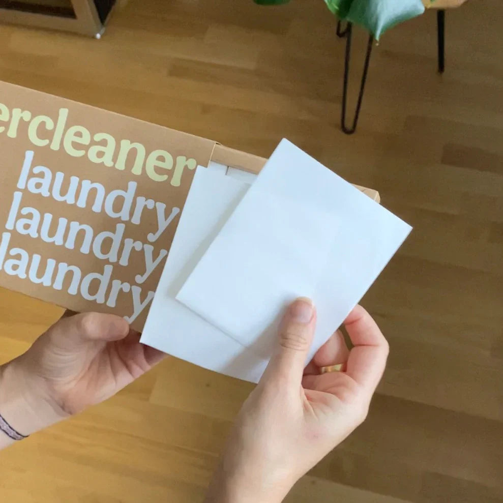 Ever Cleaner laundry detergent sheets held by hand for all wash types.